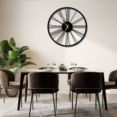 a dining room table with chairs and a large clock on the wall above it's head