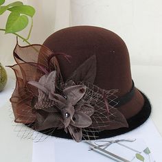 Category:Kentucky Derby Hat,Hats; Embellishment:Appliques,Feather,Split Joint,Pure Color,Trim,Splicing,Color Block,Tulle; Gender:Women's; Quantity:1 PC; Theme:Fashion; Style:Vintage Style,Elegant; Hats Category:Bowler / Cloche Hat,Bucket Hat,Fedora Hat; Occasion:Holiday,Casual,Kentucky Derby; Material:Artificial feather,Poly / Cotton Blend; Front page:WE; Shipping Weight:0.15; Listing Date:11/16/2022; Head Circumference: Gatsby Style Wide Brim Adjustable Hats, Flat Brim Top Hat For Winter Party, Elegant Costume Hats With Curved Brim For Winter, Elegant Winter Costume Hats With Curved Brim, Winter Party Top Hat With Curved Brim, Winter Party Top Hat With Short Brim, Elegant Brown Top Hat For Winter, Winter Party Top Hat With Flat Brim, Elegant Party Hats For Fall