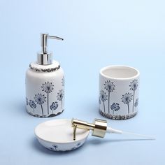 a toothbrush holder and soap dispenser on a blue background