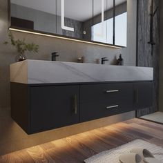 a modern bathroom with two sinks and mirrors