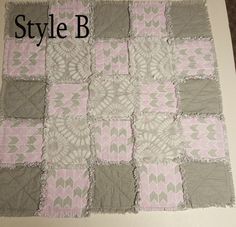 a close up of a quilt with the words style b on it