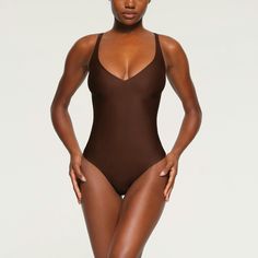 Wear this sexy plunge neck thong bodysuit alone with your favorite bottoms or under dresses to accentuate your curves and snatch your silhouette. Featur... Under Dress, Womens Bodysuit, Back Strap, Shapewear, Cocoa, Lounge Wear, Dresses, How To Wear, Quick Saves