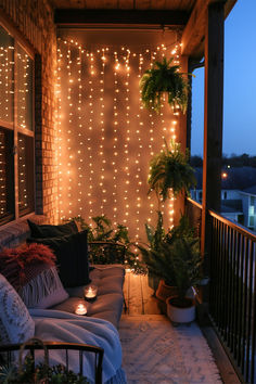 A warm and inviting balcony decorated with LED curtain lights and plants, showcasing Balcony LED Lighting Ideas. Plants And Lights Decor, Small Balcony Lights, Balcony Light Ideas, Balcony Fairy Lights Ideas, Ideas For Balcony Small Spaces, Fairy Lights On Porch, Fairy Light Balcony, Apartment Patio Lighting Ideas, Balcony Ideas Aesthetic