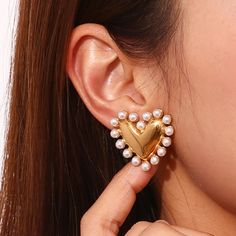 Details: Stainless steel. Water resistant. Modern Metal Jewelry For Valentine's Day, Modern Heart-shaped Metal Jewelry, Trendy Gold Jewelry With Heart Print, Modern Heart-shaped Party Jewelry, Pearl Heart Earrings, Gold Pearl Bracelet, Contemporary Vintage, Zara Jewelry, Pearl Cuff