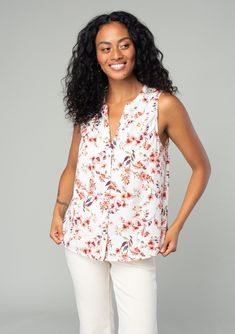 A classic sleeveless spring blouse in a natural and rose pink floral print. Floral print Relaxed fit Sleeveless Hip length Split neckline Banded collar Self-covered button front Classic spring blouse Polished enough for the office but laid-back enough for the weekend, our classic spring blouse is designed in an ultra-pretty floral print. With a split v-neckline and a delicate self-covered button front. Model is 5'8, wearing a size S.Style: I-15020W-SDT-FV Feminine Split Neck Blouse, Chic Floral Print Top With Split Neck, Pink Floral Print Blouse With Split Neck, Pink Floral Print Split Neck Blouse, Feminine Floral Print Top With Split Neck, Pink Split Neck Blouse With Floral Print, Summer Floral Print Blouse With Split Neck, Summer Floral Print Split Neck Blouse, Summer Split Neck Blouse With Floral Print