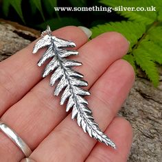 Stunning handcrafted three dimensional sterling silver fern leaf, created from an actual fern leaf, collected from the heart of the beautiful Cheshire countryside. Lovingly hand finished with a dark patina to lift detail and capture that special symbol forever in solid sterling silver. Complete with a sterling silver jump ring and silver soldered joints for extra piece of mind. A well known symbol of protection from spiritual enemies, wealth, good luck, and fortune in many faiths. Quite simply the perfect gift for any nature lover. Please keep in mind that this is a handmade piece of jewellery, which may result in slight variations in size, colour, and shape. It may also possess very slight imperfections, adding to its unique charm. Silver Fern, Special Symbols, Botanical Collection, Leaf Necklace, Unique Charms, Metal Jewelry, Silver Fashion, Beautiful Necklaces, Hippie Boho