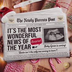 the news paper has been placed on top of candy canes and candies, with christmas decorations around it