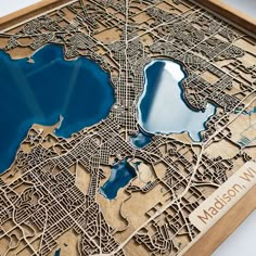 a wooden cutout map of washington, d c with blue water in the middle