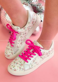 Strut your stuff in these enchanting sneakers! With white floral prints, pink laces, glittering stars, and shiny silver accents, they bring a playful pop to any outfit. Perfect for making everyday adventures extra special! Details Lace-Up; comes with an additional WHITE set of shoelaces Metallic details Glitter star Detail Padded Insole Round Toe with Man Made Sole Sizes: 6-11 Fit: Fits True To Size, If Between Sizes We Recommend Going Up One Size Prints Pink, Everyday Adventures, White Set, Glitter Stars, Denim Shoes, Silver Accents, Shiny Silver, Pink Lace, The Struts