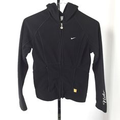 Vintage Nike Full Zip Hoodie Features a Full front zip, Black Satin piping trim on Front & Back panels, Hood & Sleeves, front zip pockets, embroidered Swoosh Logo, The word NIKE embroidered on left sleeve Size: S (4-6) Color: Black/Black Material: 100% Polyester; Machine wash Approx. measurements taken laying flat: 19” Armpit to armpit 22” Length from shoulder to bottom hem 20" Sleeve length from armpit to end of sleeve In very good pre-owned condition - **see pictures for additional item descri Women's Hoodies, Swoosh Logo, Nike Hoodie, Women Hoodies Sweatshirts, Women's Coats & Jackets, Lookbook Outfits, Full Zip Hoodie, Vintage Nike, Black Satin