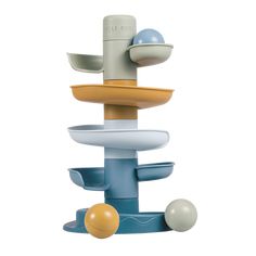 a toy that is sitting on top of a stand with balls in the bottom half