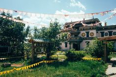 there is a building that has been decorated with flags and buntings on it