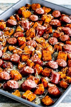 a baking pan filled with cooked sweet potatoes