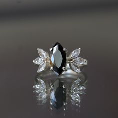 a black and white ring sitting on top of a table