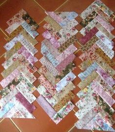 a patchwork quilt is laying on the floor