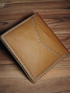 **Handcrafted Leather Wallet: A Unique Touch Reflecting Your Style** Enjoy the elegance and luxury of a handcrafted wallet made from genuine leather. This wallet features a unique design that ensures you stand out, combining high quality with functionality. **Why Choose This Wallet?** 1. **Unique Design Each wallet has a distinct artistic touch, making it a one-of-a-kind piece. 2. **Genuine Leather Made from high-quality natural leather, ensuring durability and beauty over time. 3. **Practical and Convenient Includes multiple pockets to organize your cards, cash, and essential documents. 4. **Perfect Gift A wonderful option for a special and memorable gift for friends and family. Invest in a handcrafted wallet made from genuine leather, and make every moment special with an artistic touch Leather Wallet With Leather Lining As Gift, Handmade Brown Wallet For Formal Occasions, Handmade Artisan Leather Trifold Wallet, Handmade Bifold Wallet For Formal Occasions, Modern Leather Trifold Wallet For Gifting, Artisan Handmade Leather Trifold Wallet, Modern Leather Trifold Wallet For Gift, Artisan Leather Rectangular Wallet, Modern Leather Trifold Wallet As Gift