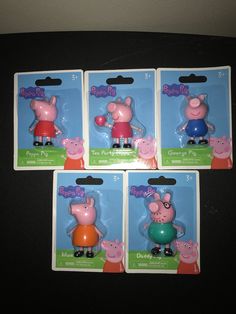 three peppa pig action figures in plastic packaging