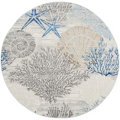 a round rug with blue and white corals on it