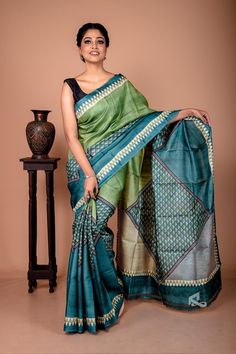 This saree has geometric patterns. The triangle motifs throughout the saree make it look more beautiful. The pattern of triangles with different shades of green makes this gachi tussar saree from Bengal a very desirable piece. Two shades of green complement each other very well. It is a minimalistic yet highly attractive tussar saree. It is perfect for your occasion wear as well as corporate wear. Like all of our sarees, this is also a silk mark-certified saree. Hence, you don't have to worry ab Green Block Print Saree, Green Block Print Saree For Diwali, Festive Green Block Print Saree, Green Tussar Silk Dupatta With Block Print, Green Block Print Art Silk Saree, Pure Tussar Silk Saree, Tussar Saree, Geometric Texture, Corporate Wear