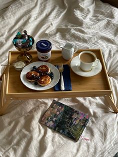 a tray that has some food on it and a cup of coffee next to it