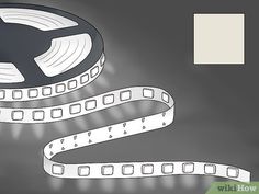 a roll of white film sitting on top of a black table next to a light