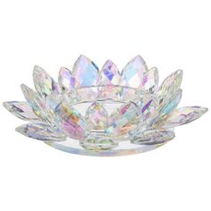 a clear glass bowl filled with lots of crystal stones