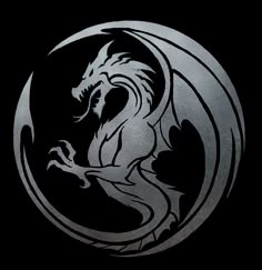 a silver and black dragon is in the middle of a circular metal design on a black background