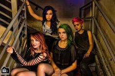 four beautiful young women sitting on the stairs