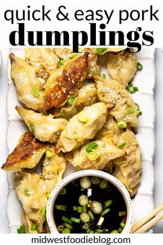 an image of dumplings on a plate with chopsticks and sauce in the bowl