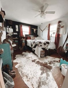 a bedroom with a cow hide rug on the floor