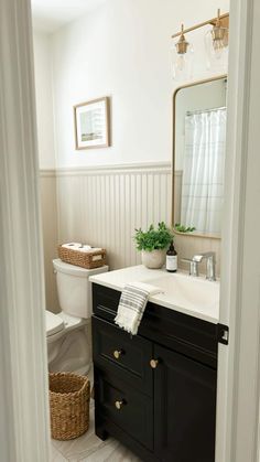 a white toilet sitting next to a sink in a bathroom under a mirror with the caption above it