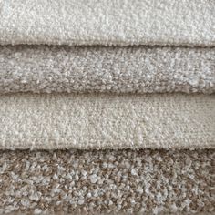 four different colored carpet samples stacked on top of each other