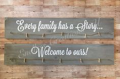 two wooden signs that say, every family has a story and welcome to ourss