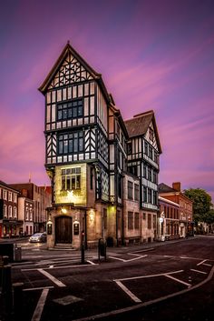 an old building is lit up at night