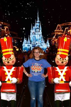 a woman standing in front of some nutcrackers