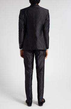 The brand's slim Sicilia fit shows off the silk-shantung construction to its fullest richness of texture and sheen on this Italian-tailored two-piece suit. Jacket has peaked lapels; four-button cuffs; chest welt pocket; front flap pockets; two interior pockets; back vent Pants have zip fly with hook-and-bar closure; front slant pockets; coin welt pocket; back button-welt pockets Jacket is lined; trousers are lined to the knee 100% silk Dry clean Made in Italy Men's Designer Clothing Luxury Fitted Suit For Festive Season, Luxury Fitted Formal Sets, Classic Festive Evening Sets, Classic Evening Sets For Festive Occasions, Elegant Festive Business Sets, Classic Satin Business Suit, Tailored Satin Elegant Suit, Classic Satin Suits For Semi-formal Occasions, Festive Fitted Evening Suits