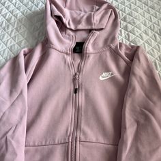 A Pink Nike Zip Up Jacket With Pockets And A Hoodie. Brand New Without Tags Fleece Track Jacket For Spring Athleisure, Spring Fleece Track Jacket In Athleisure Style, Spring Fleece Hoodie With Pockets, Spring Fleece Sweatshirt With Pockets, Pink Athleisure Outerwear With Ribbed Cuffs, Pink Long Sleeve Sweatshirt With Zipper, Pink Long Sleeve Sweatshirt With Zipper Closure, Spring Sports Fleece Outerwear, Fleece Athleisure Long Sleeve Outerwear