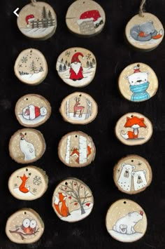 twelve hand painted wooden ornaments with animals on them