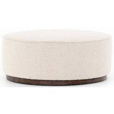 a white round ottoman with wood trim on the top and bottom, in front of a white background