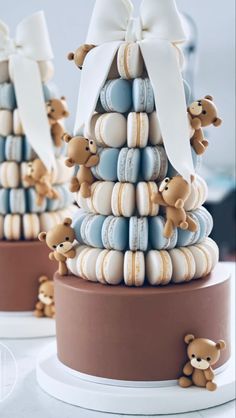 a cake made to look like a christmas tree with teddy bears on top and cookies in the shape of trees