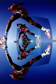 the reflection of two football players in their uniforms is shown on the water's surface