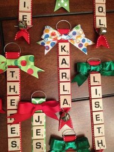 wooden letters and bows are hanging on the door to spell out names for christmas or new year's eve