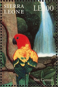 a stamp with a bird sitting on top of a tree branch next to a waterfall