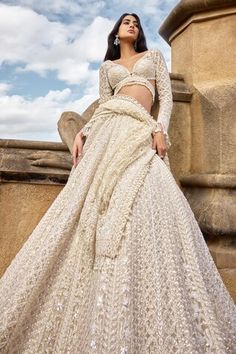 Ivory attached cancan lehenga with pearl, sequin, thread embroidery in geometric pattern. Paired with plunge V neck embroidered padded blouse and dupatta. - Aza Fashions Royal Indian Wedding Dress, Cop Husband, Pretty Lehengas, Aria Outfits, Pearl Lehenga, Shaadi Outfits, Full Sleeves Blouse, Hand Embroidered Skirt, Ivory Lehenga