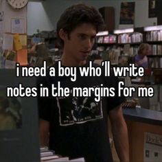 a man standing in front of a computer with the words i need a boy who'll write notes in the marginals for me