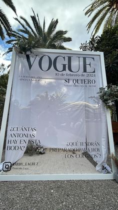 the front cover of a magazine with palm trees in the background