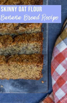 a loaf of banana bread sitting on top of a blue tray next to a red and white checkered napkin