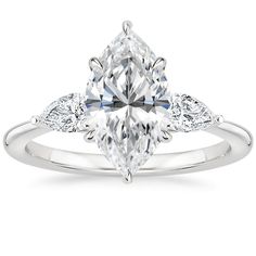 a white gold engagement ring with a pear shaped diamond