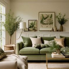 a living room filled with lots of green furniture