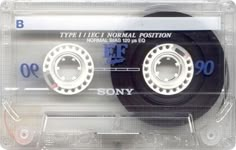 an old cassette with some type of tape on it's front and back sides